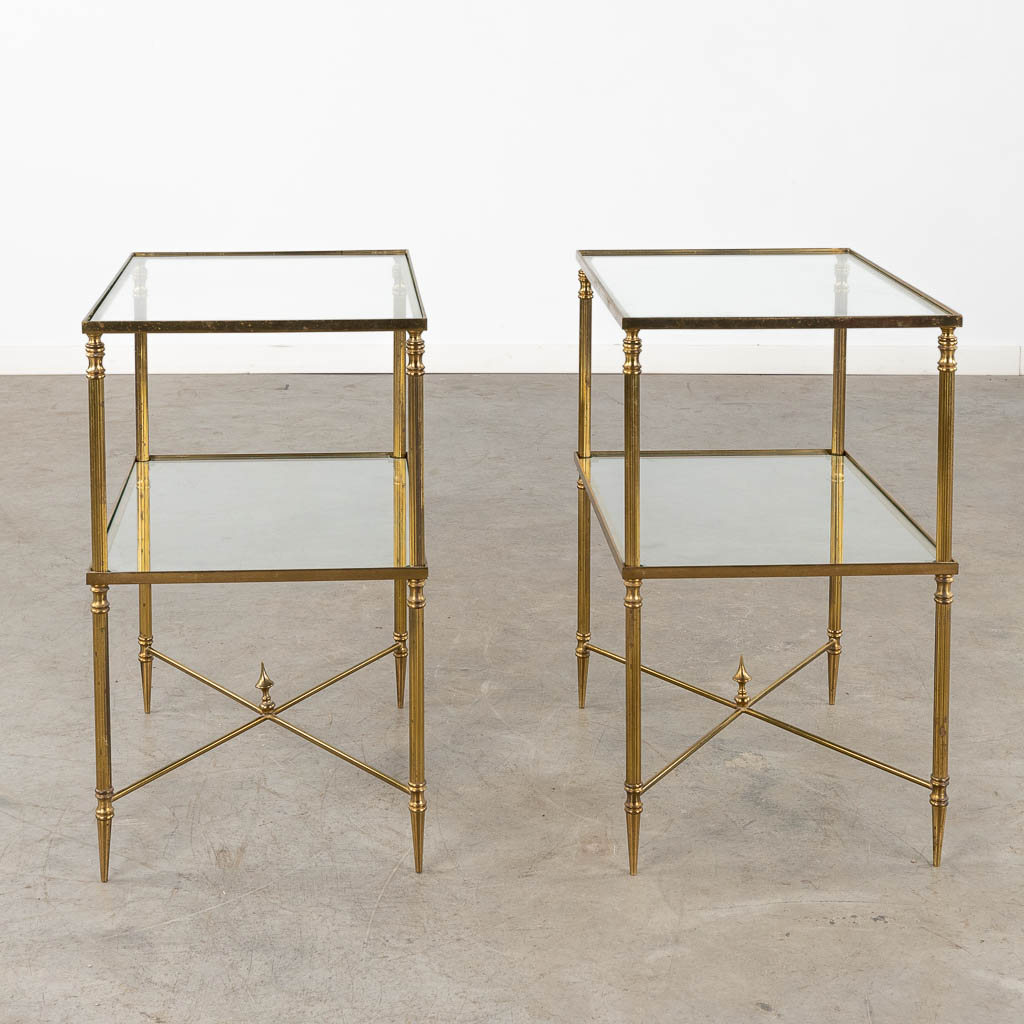 A pair of two-tier side tables, brass and glass in the style of Maison Jansen. (D:35 x W:50 x H:60 cm)