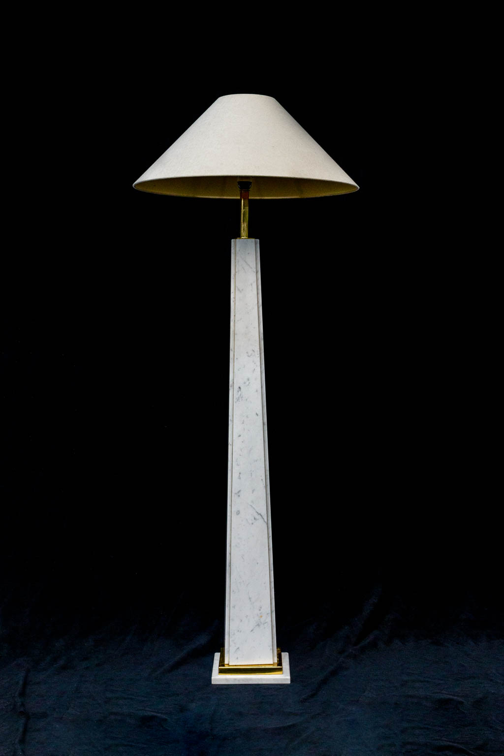 A standing lamp made of White carrara marble, combined with brass. 1960's. 