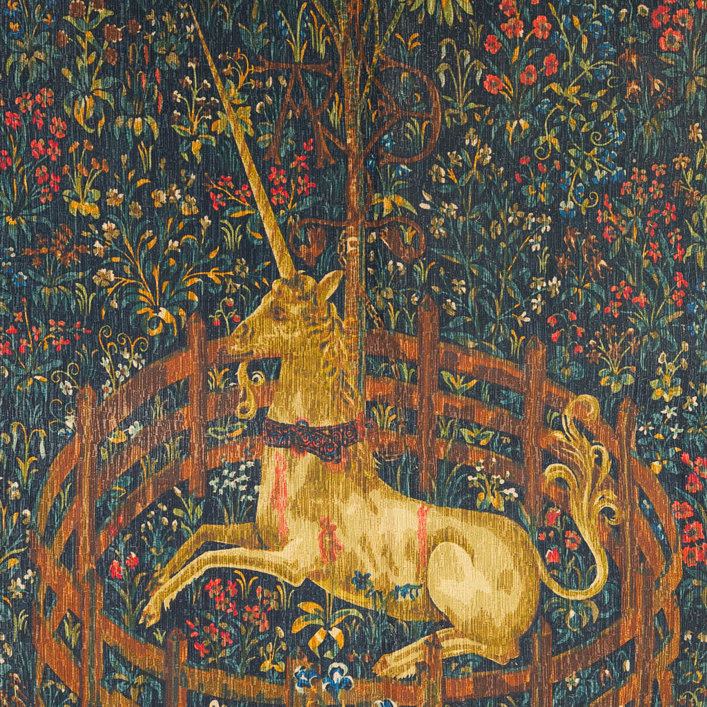 A tapestry with a printed image of a unicorn in a flower field. (H:136cm)