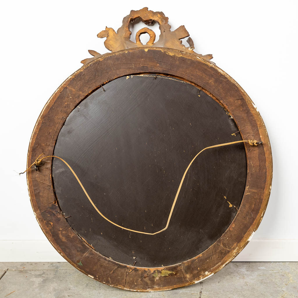 An antique round mirror, Louis XVI style. 19th C. (W:64 x H:76 cm)
