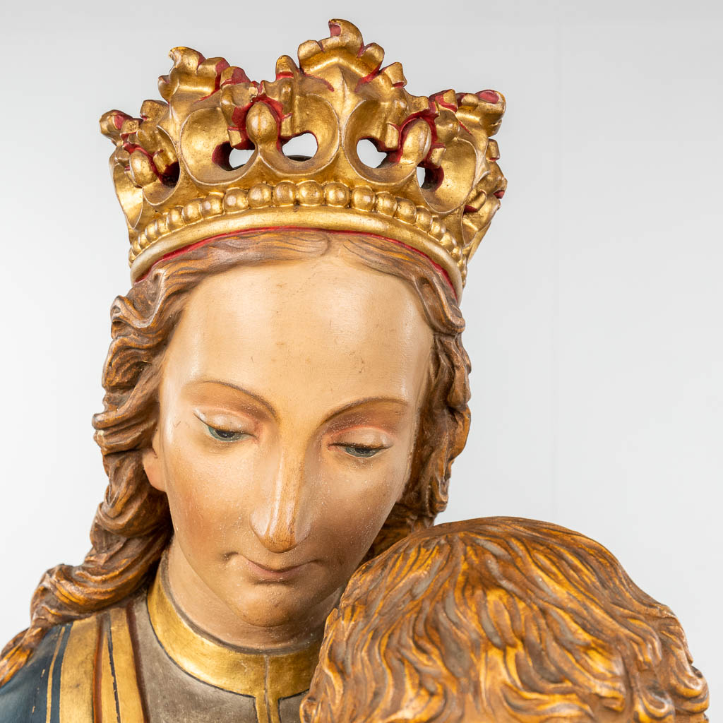 An antique wood-sculptured Madonna with child, original polychrome paint. 19th C. (L: 33 x W: 43 x H: 138 cm)