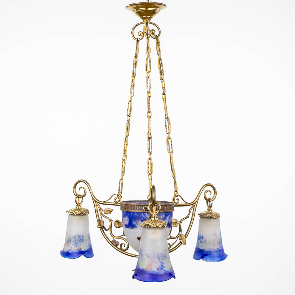 An art-deco chandelier made of bronze and mounted with pâte-de-verre glass lampshades, marked Loti, Nancy. (H:80cm)