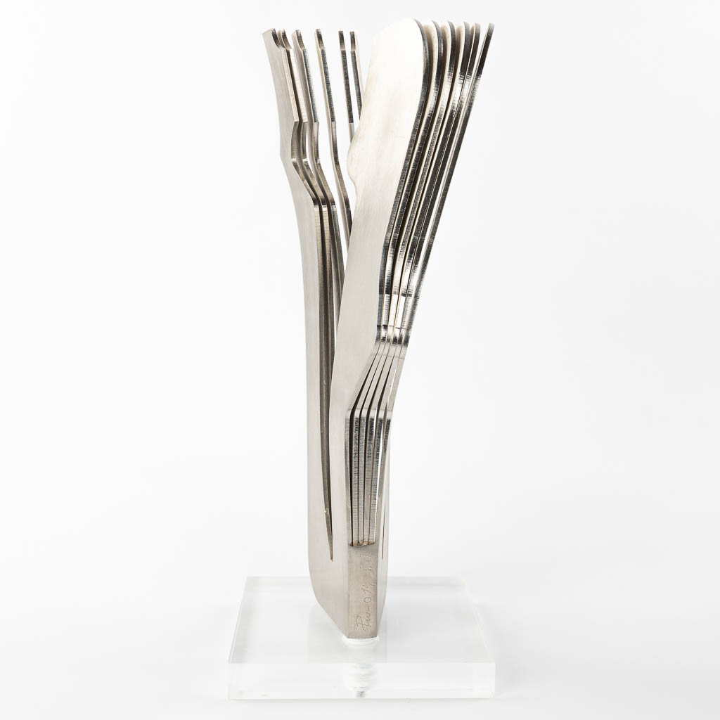 Adriano PIU (1954) 'Abstract' a sculpture made of steel on an acrylic base. (H:35cm)