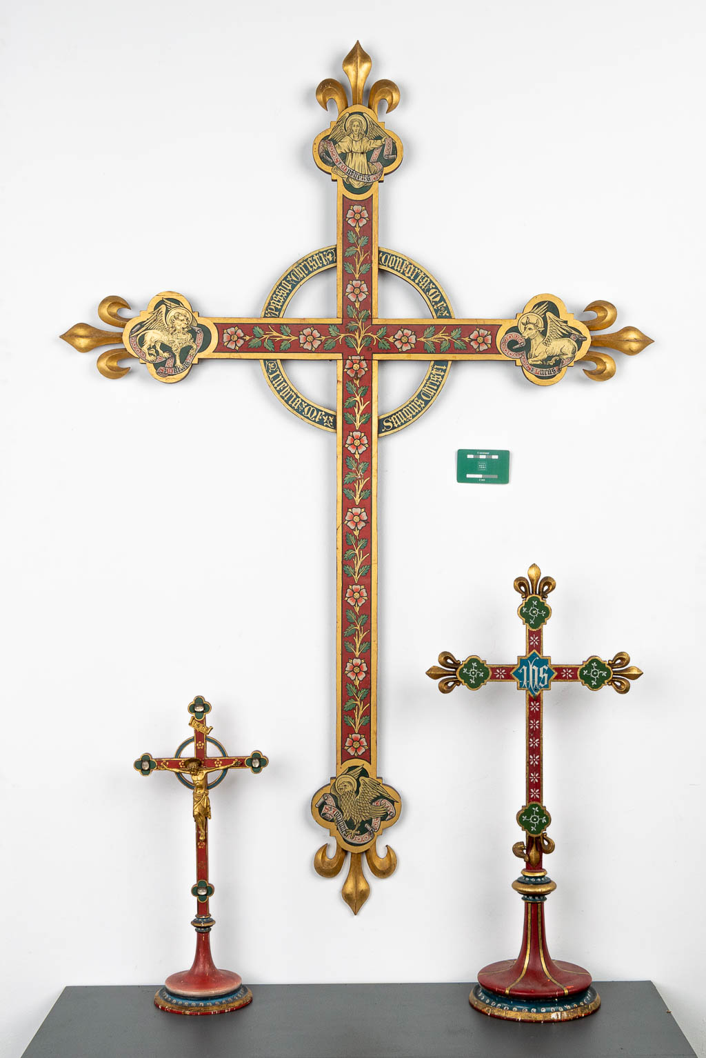 A collection of 3 polychrome gothic revival style crucifixes. (H:141cm)