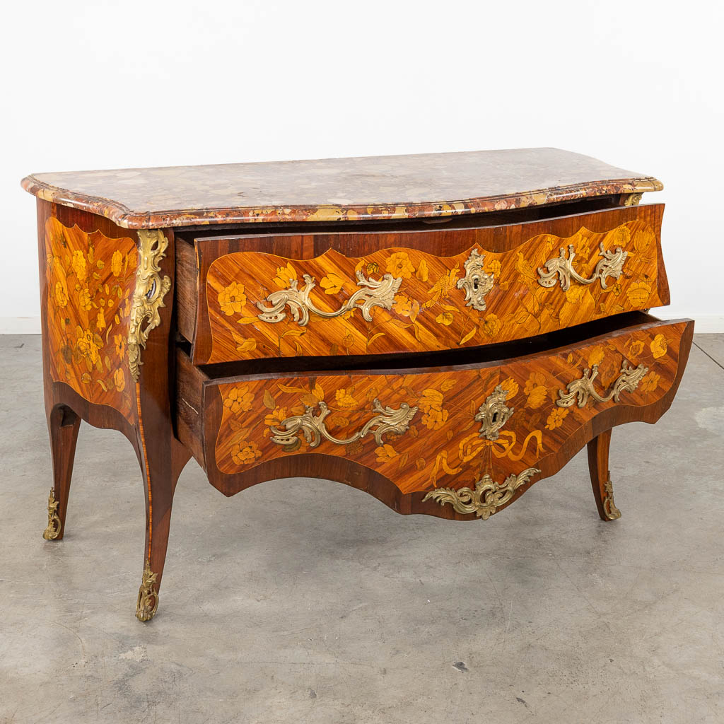 A commode, Louis XV, two drawers with marquetry veneer and mounted with bronze. 18th C. (D:65 x W:145 x H:89 cm)