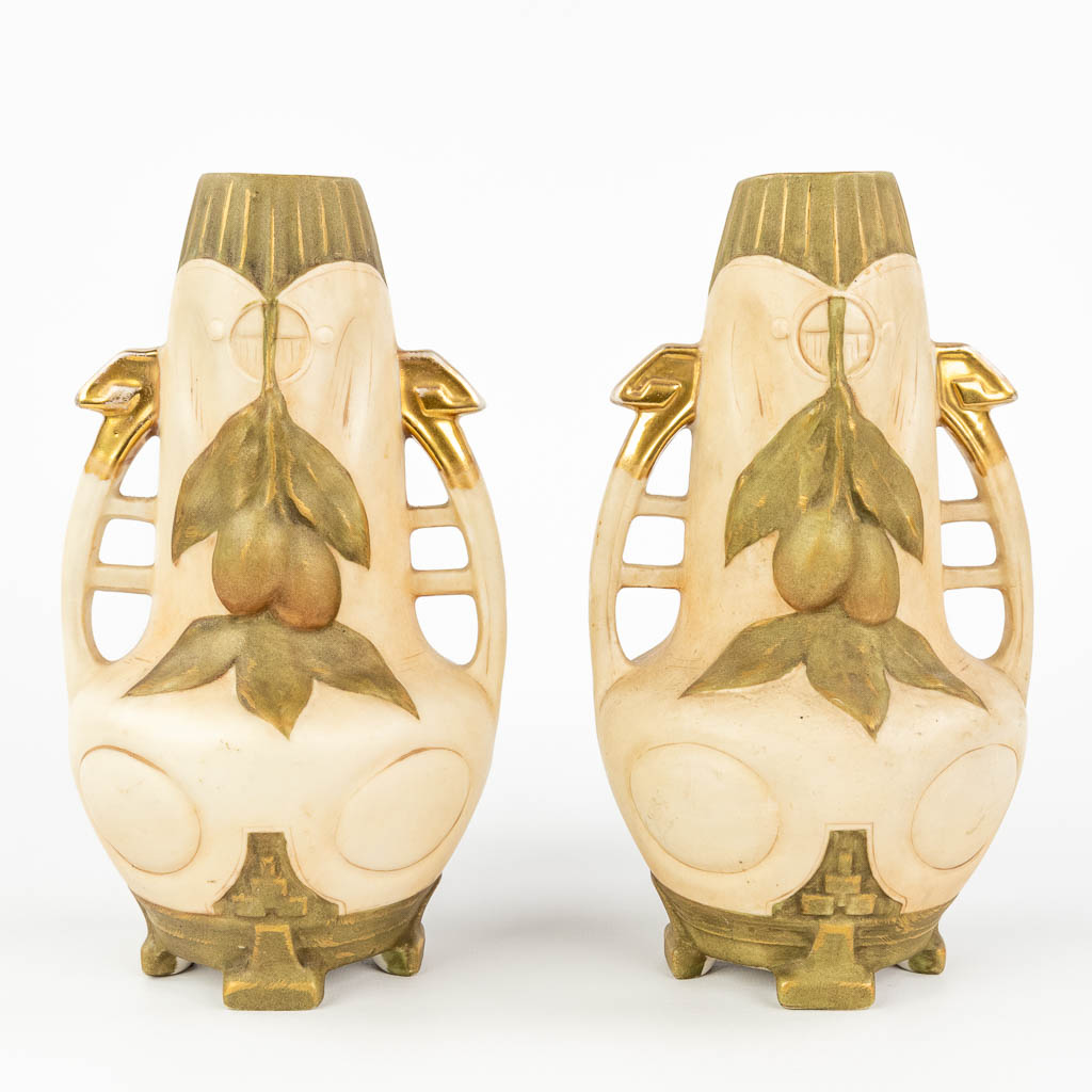 Royal Dux, a pair of vases made of faience in art nouveau style.  (H:21,5 x D:12 cm)
