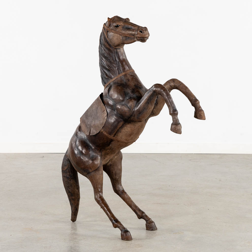 A decorative 'Prancing Horse', leather. (L:27 x W:67 x H:100 cm)