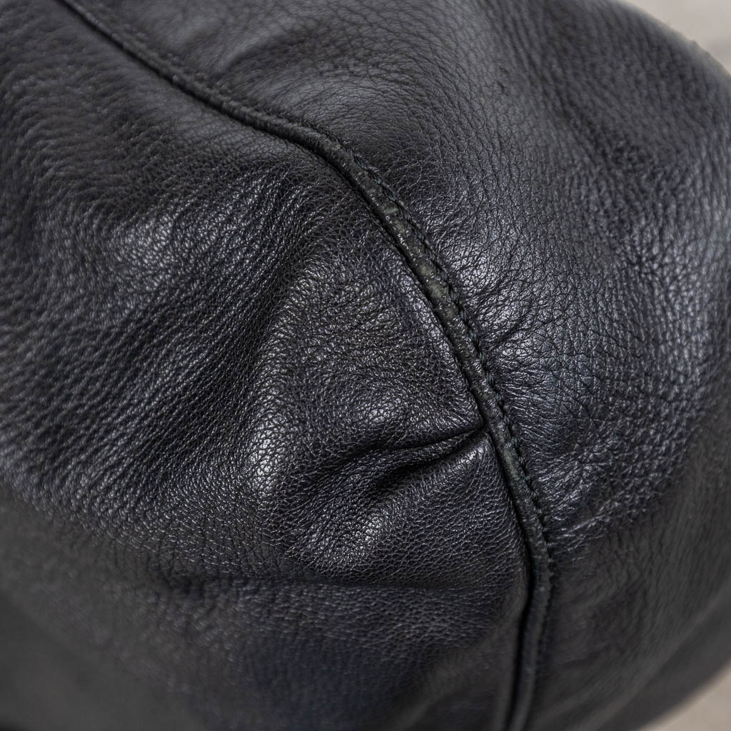 Gucci, a handbag made of black leather, with original belt. (W:40 x H:35 cm)