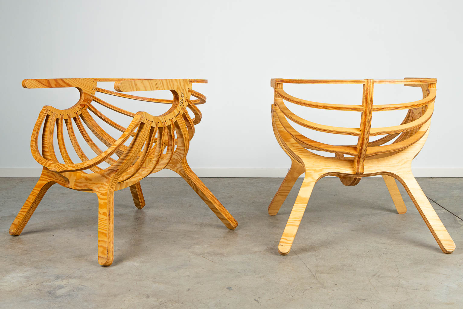 A pair of lounge chairs, made of plywood cut on the CNC machine. 21st century