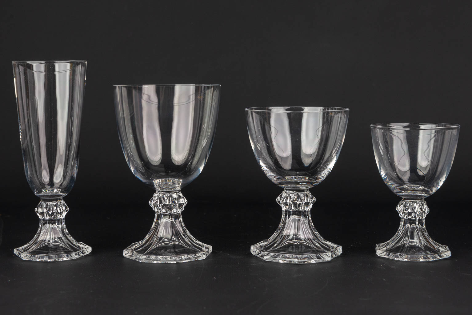 A collection of 31 glasses made by Val Saint-Lambert. (H:16,3cm)