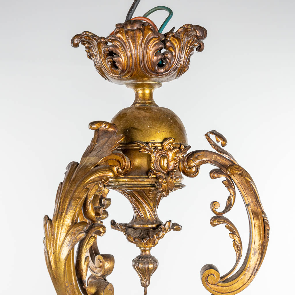 A large chandelier made of bronze in Louis XV style and finished with glass shades. (H:103cm)